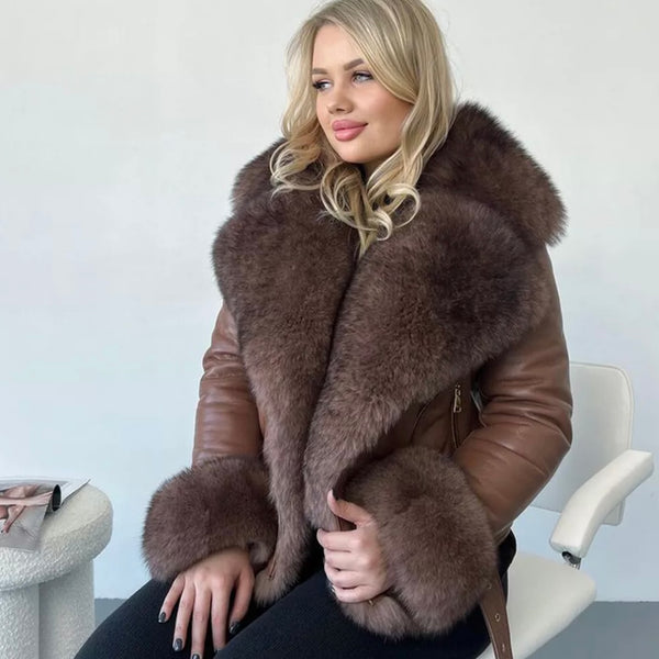 Woman wearing a brown fur coat against a plain background